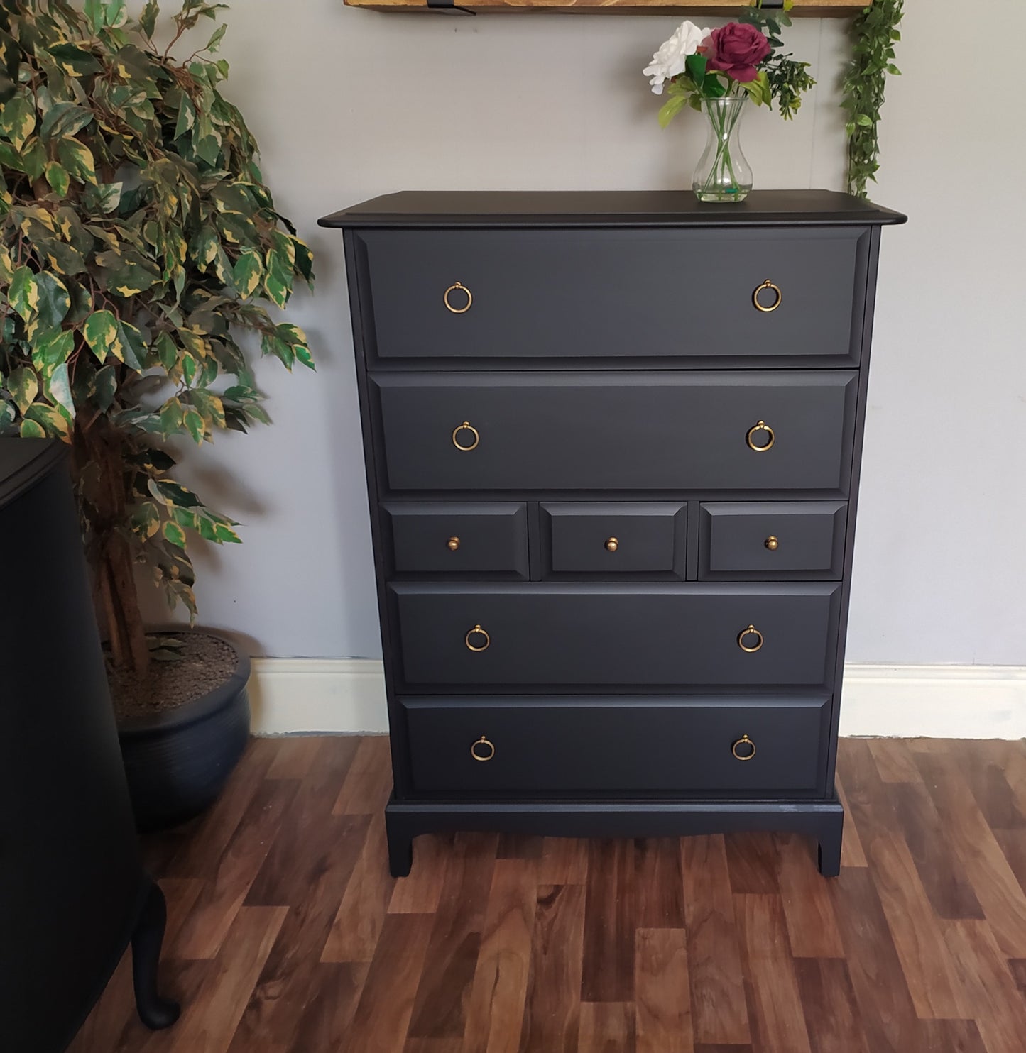 851 : Stag Minstrel Tallboy chest of drawers