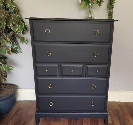851 : Stag Minstrel Tallboy chest of drawers
