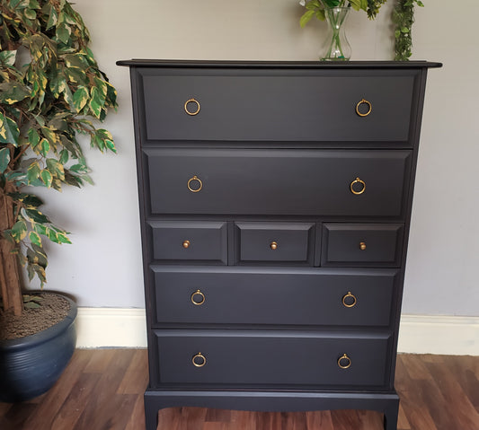 851 : Stag Minstrel Tallboy chest of drawers